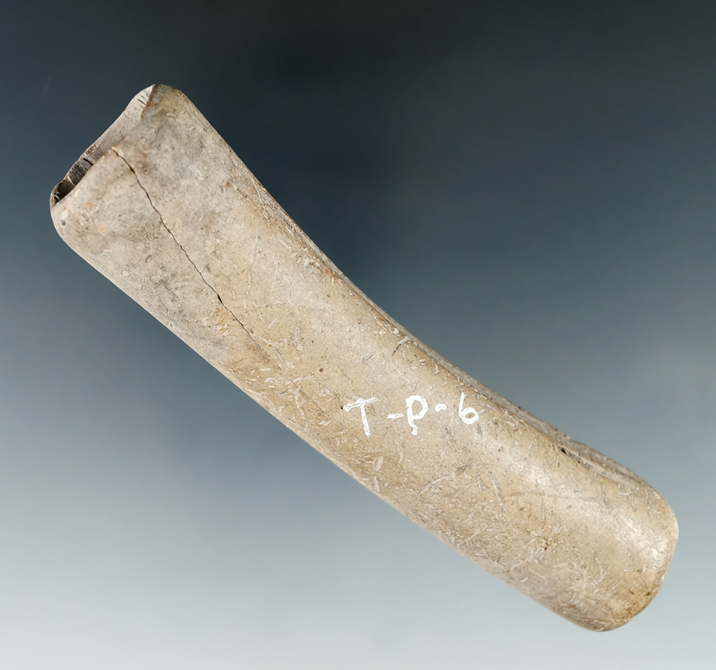 4 and 1/16" bone handle or large tube bead found in Tennessee.
