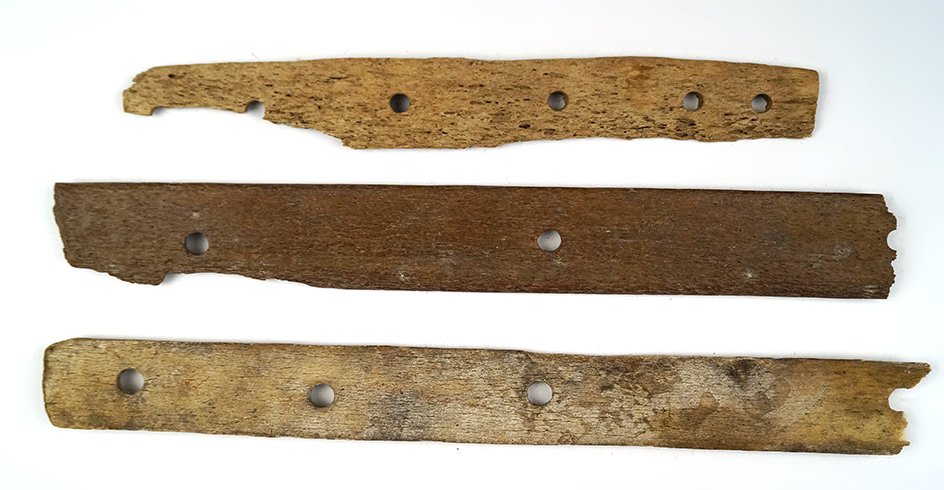 Set of three sections of Inuit bone armor found in Alaska, largest is 11 3/4".
