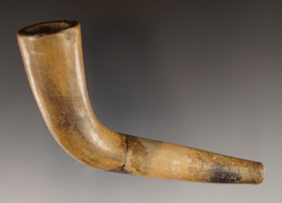 4 1/4" Early Iroquois Clay Pipe that is broken and glued near the elbow. Found in Canada.