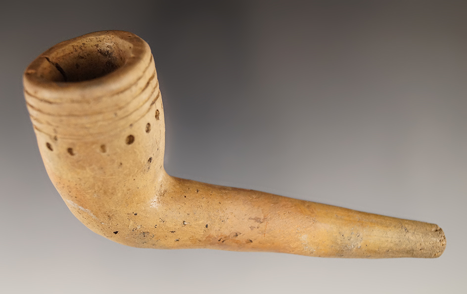 4 1/2" Iroquois Ring Bowl Clay Pipe with a broken and mended stem. Found in New York.