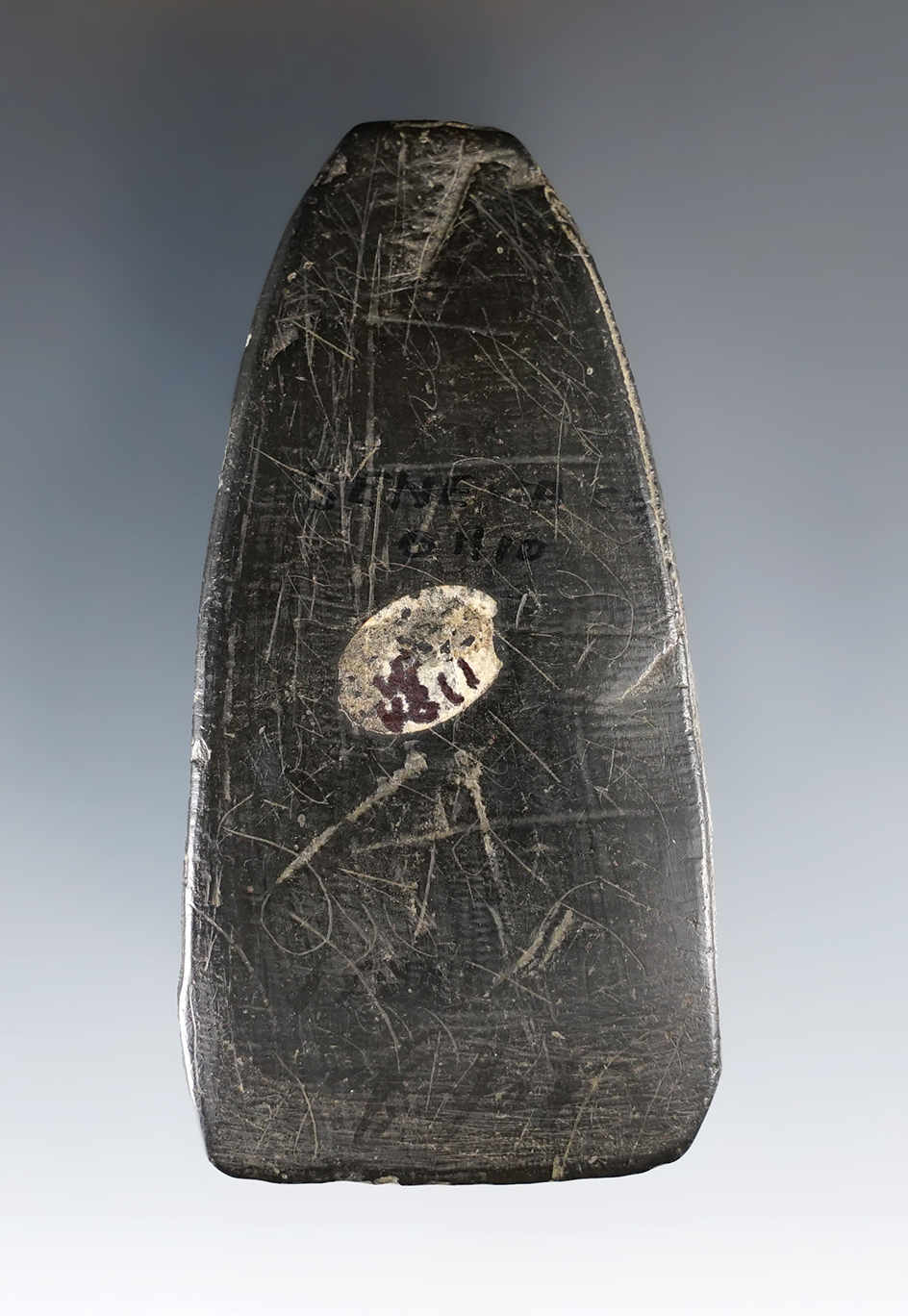 3 1/16" black slate Celt found in Seneca Co., Ohio. Highly engraved.