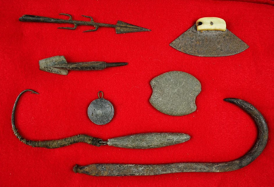 Group of Alaskan artifacts includes a 3 1/4" wide Ivory handled metal Ulu and a  8" iron hook.