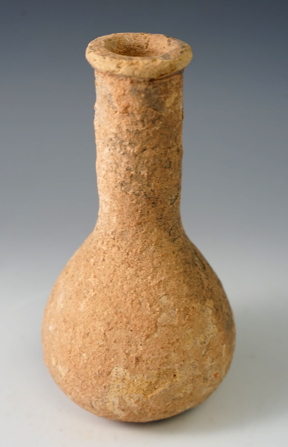 5 5/8" tall old world pottery vessel in solid condition. Makes a nice display item.