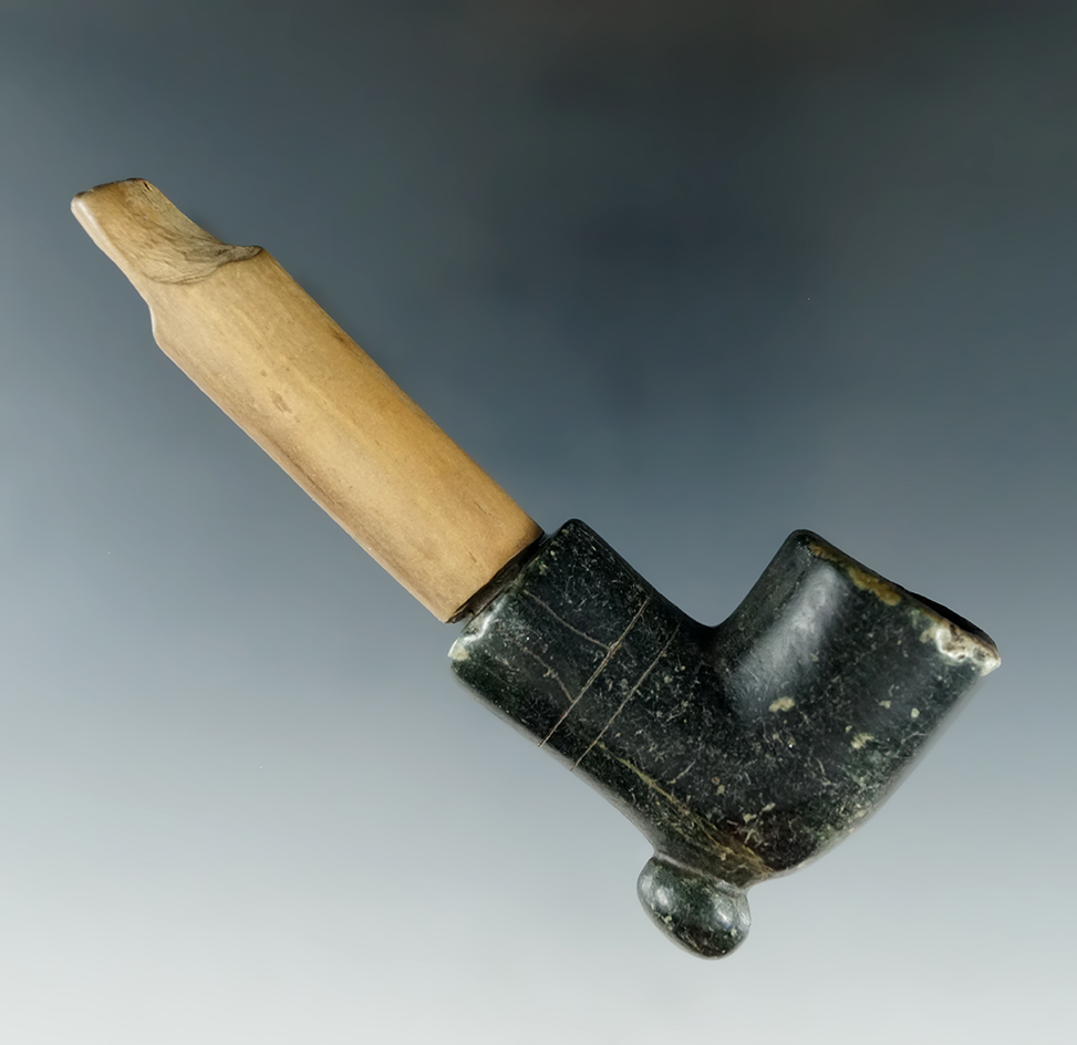 Historic Elbow Pipe, 3 13/16". Decorated Steatite pipe bowl with patinated wooden stem.