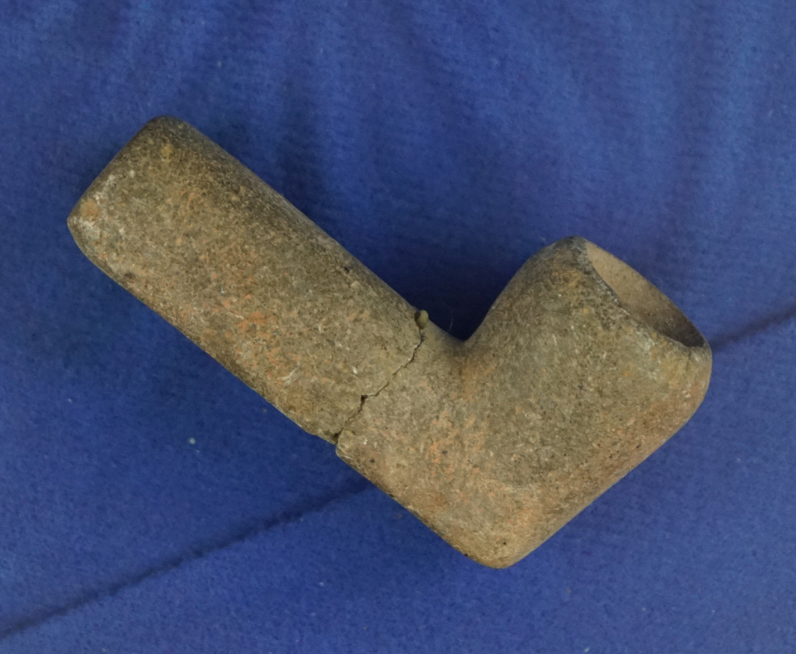 2 1/16" Eastern stone pipe that is broken and glued at the mid-section - very heavily patinated.