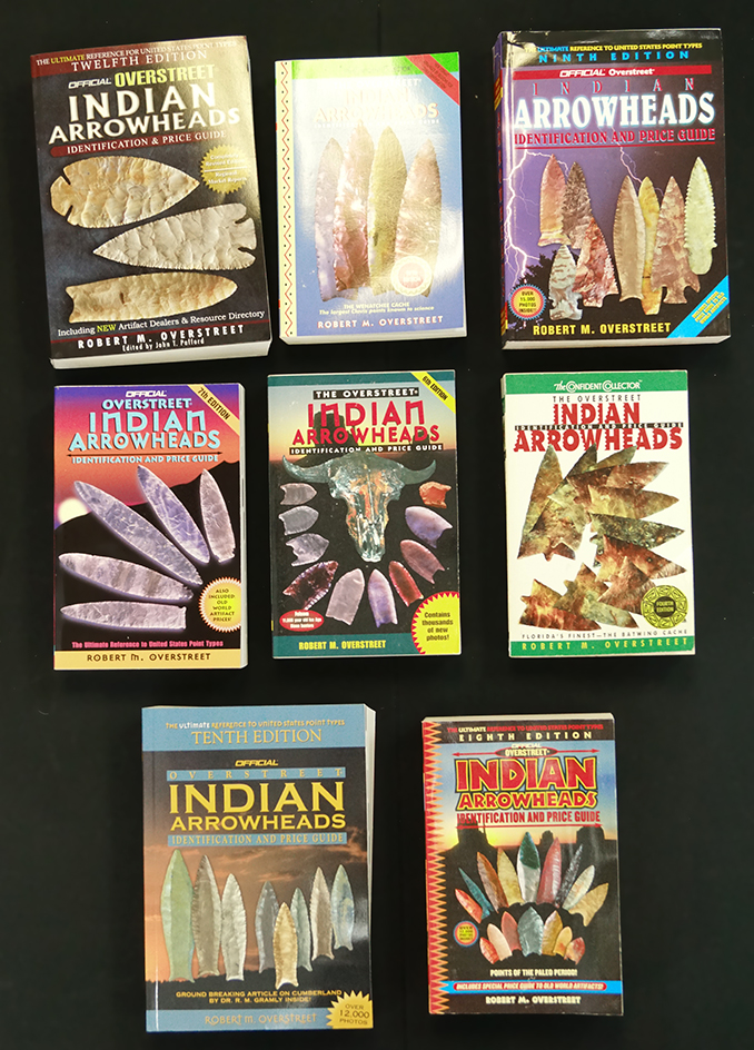 Set of eight Overstreet price guides including volumes 4, 5, 6, 7, 8, 9, 10, 12.