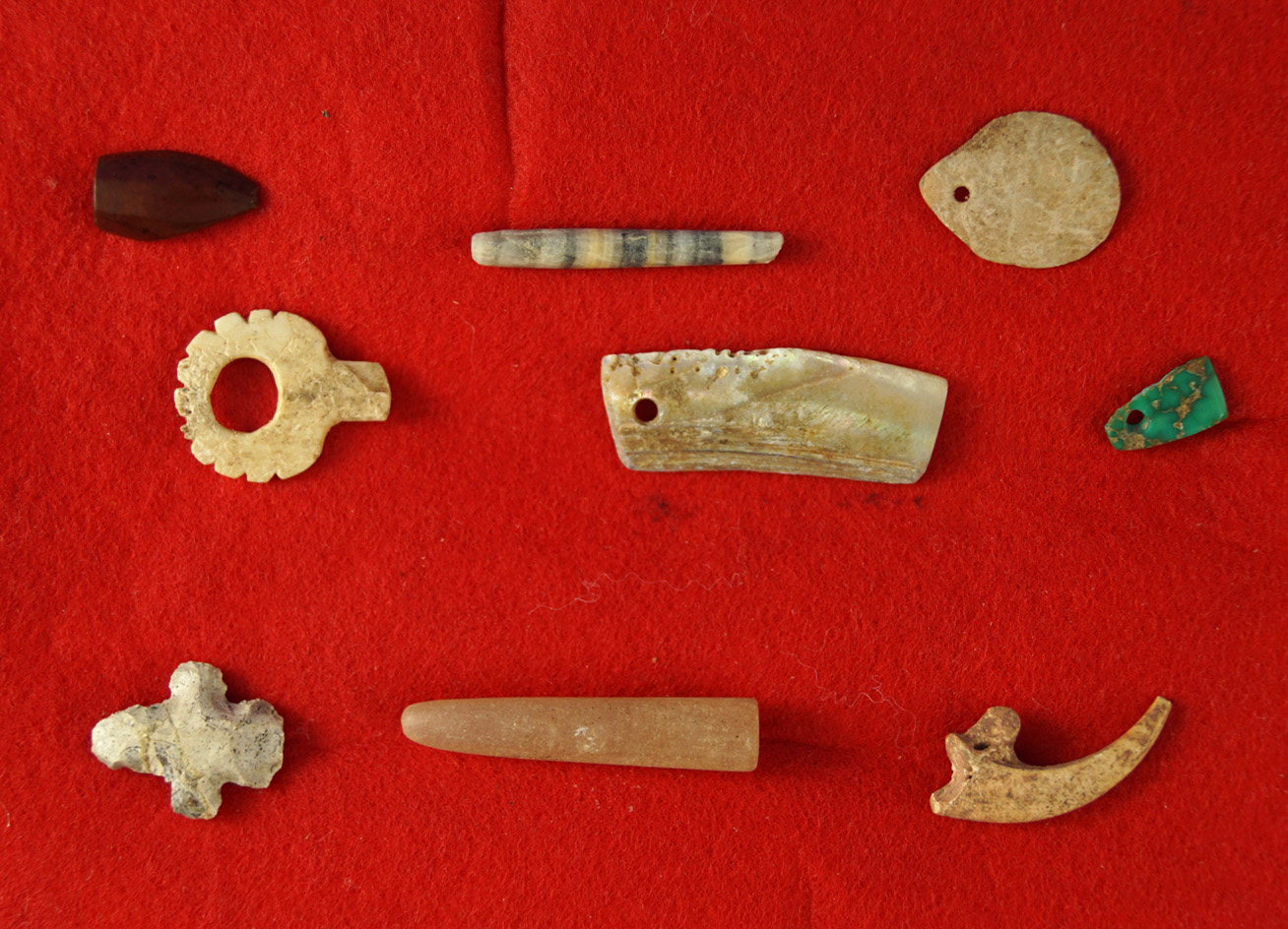 Group of assorted artifacts found near Witch Well Arizona Includes beads and Shell pendants.