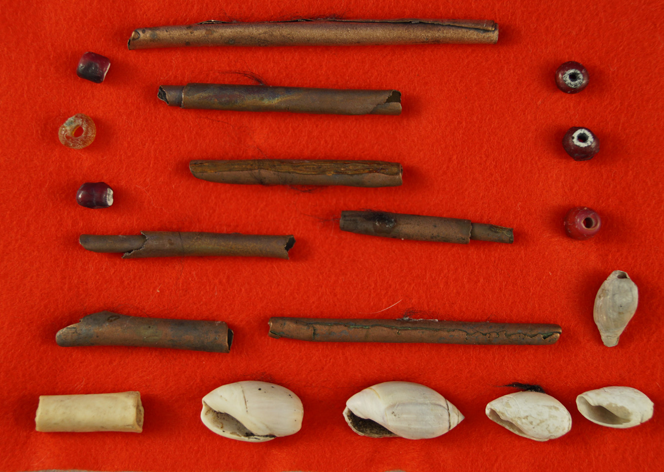 Group of assorted copper, shell and trade beads found in 1961 near Klamath, Oregon.