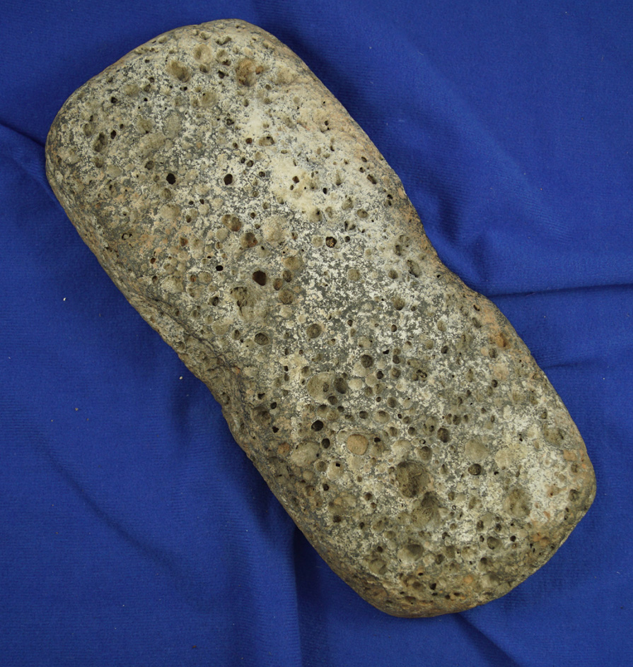 Large 10 1/2"Mano/grinder with unique finger indents on both sides found in Arizona.