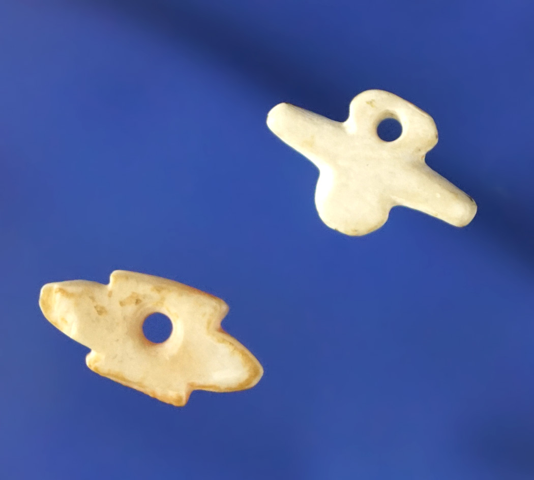 Nice pair of drilled shell pendants found in Arizona. Both are around 5/8" long.