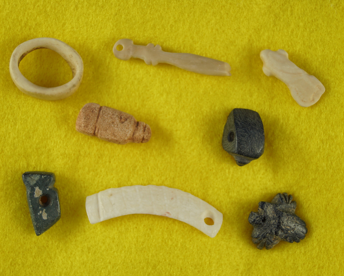 Beautiful set of eight stone and bone pendants found on Anasazi sites in Arizona. Largest is 1 13/16