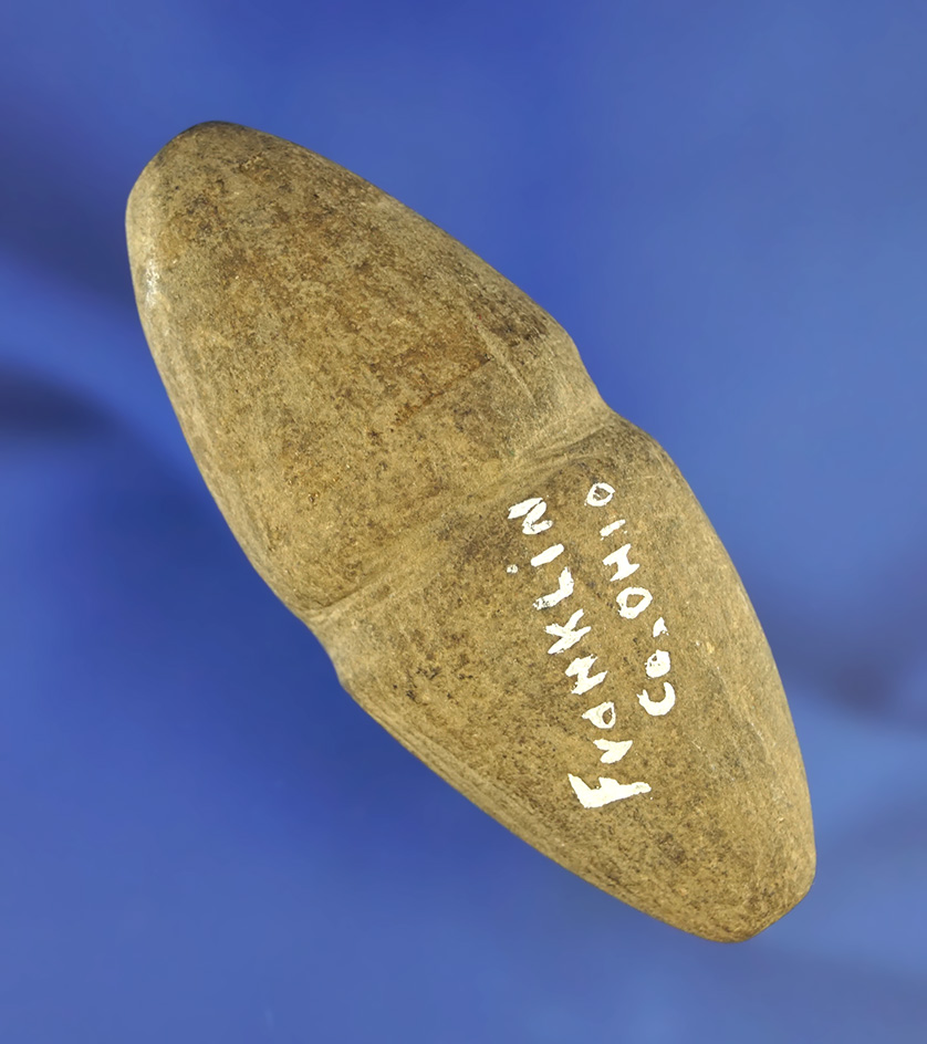 Uniquely styled 3 1/8" center grooved Atlatl weight found in Franklin Co.,  Ohio.