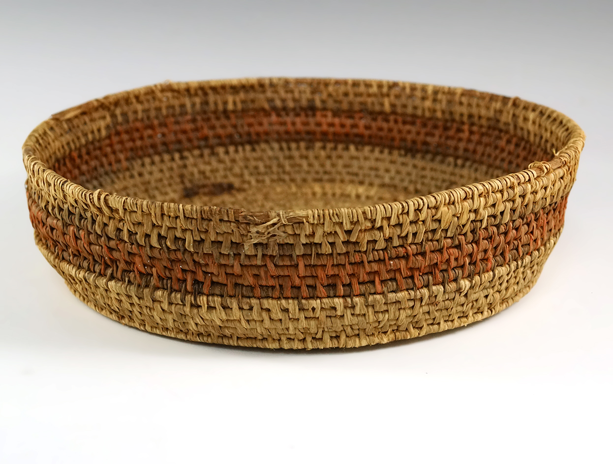 Minor rim damage to this vintage 8 1/8" wide basket.