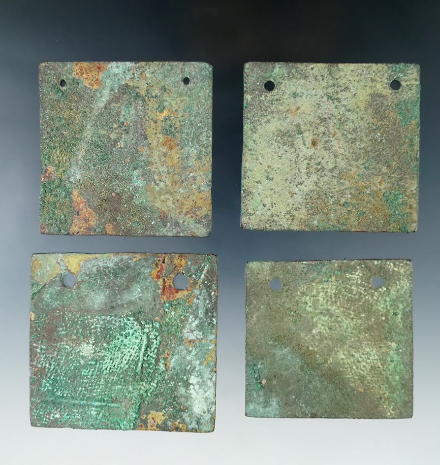 Set of four copper Gorgets, largest is 2 3/8" by 2 1/4", found in Peru. Ex. Richard Shively estate a