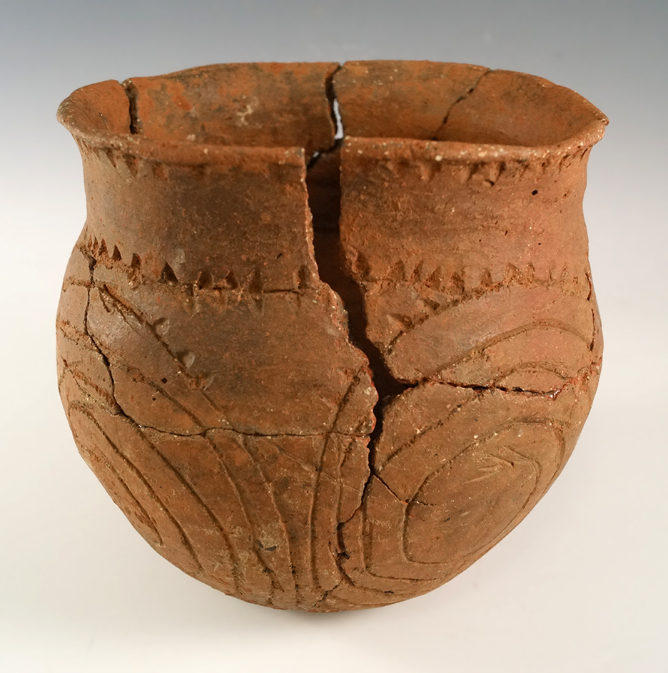 5 3/4" x 5 1/2" Patton Engraved Jar (E. Texas) with reattached pieces, and one piece missing.