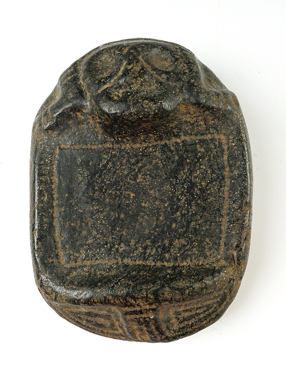 7 7/16" tall by 5 1/8" wide Taino Human Footed Pallet carved from Black Stone. 