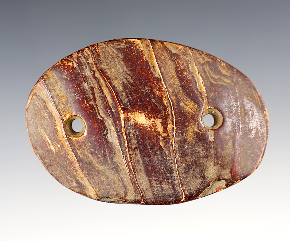 Very heavily patinated 3 3/16" Gorget made from shell. Found in Cayuga Co., New York. 