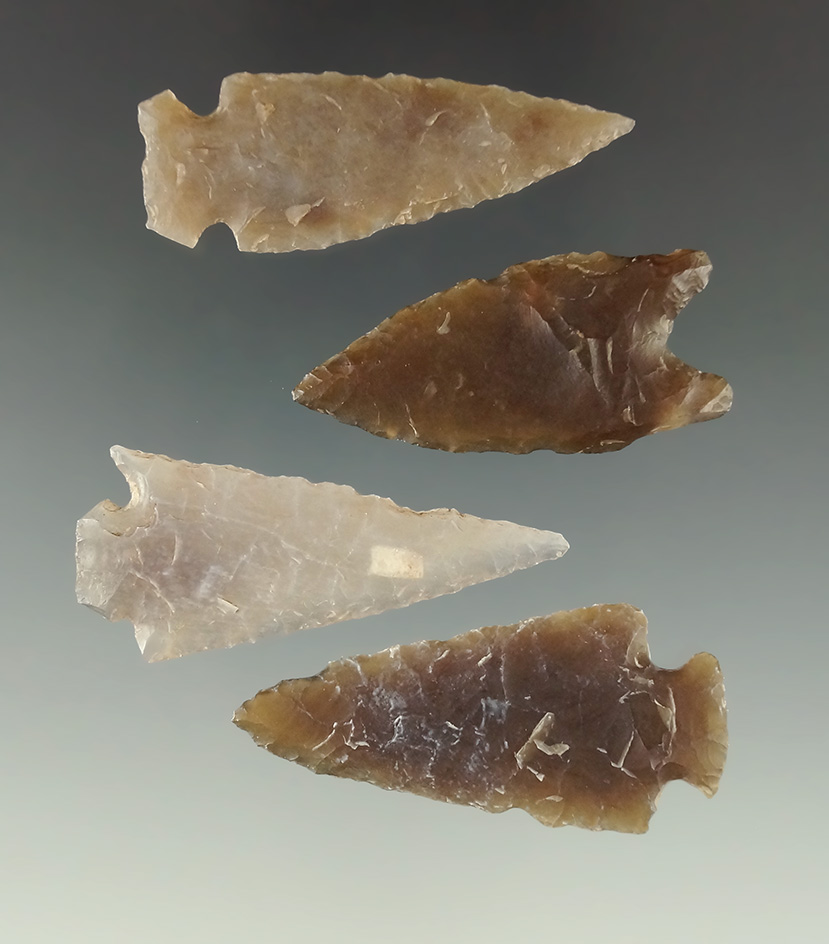 Set of four beautifully translucent high-grade Flint arrowheads found in the Dakotas.