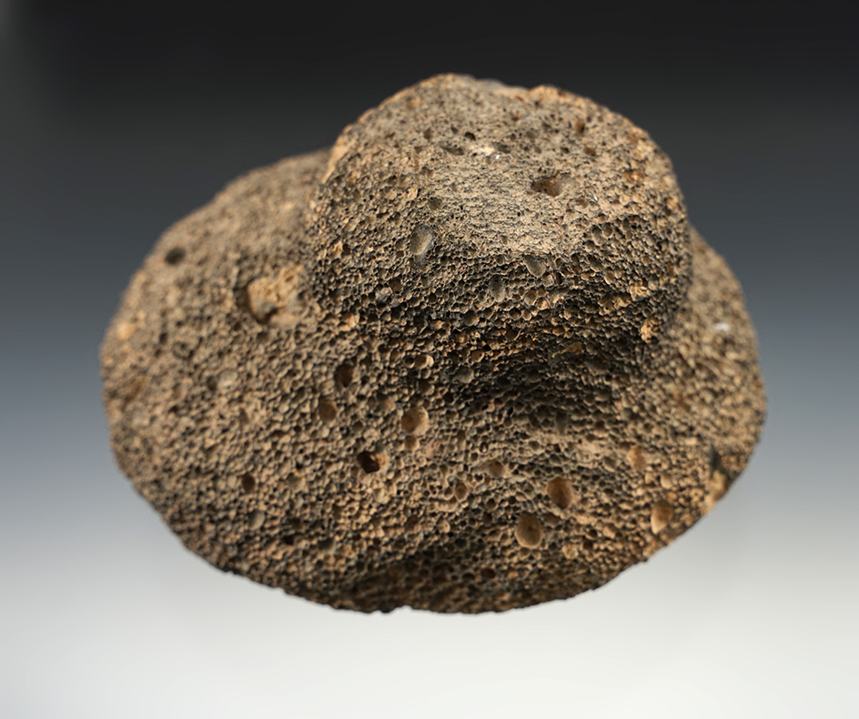 Uniquely styled 4 3/4" lava stone Mano with a handle area.