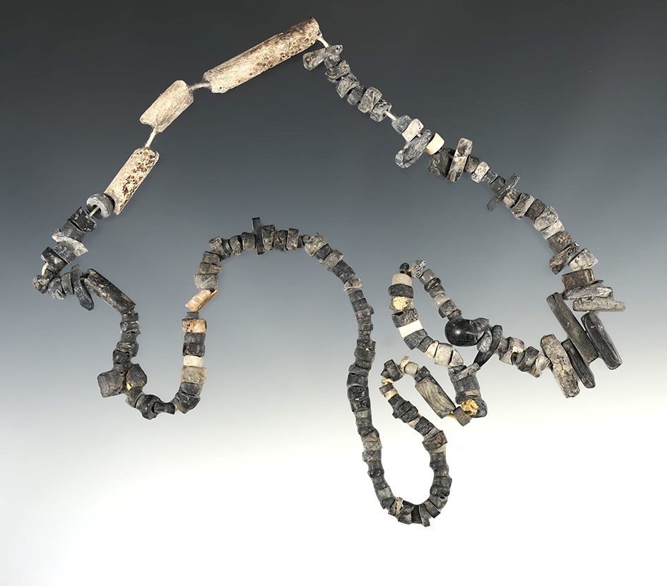 26" long strand of drilled mostly stone beads found at a site in New Mexico.