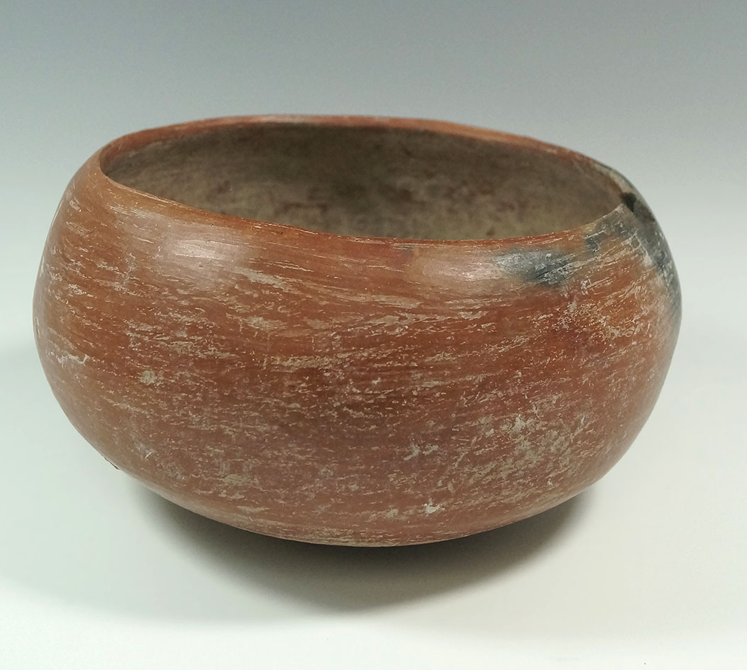 6" tall  Casas Grandes redware bowl, solid with rim chip and probe hole. Arizona – Mexico border.