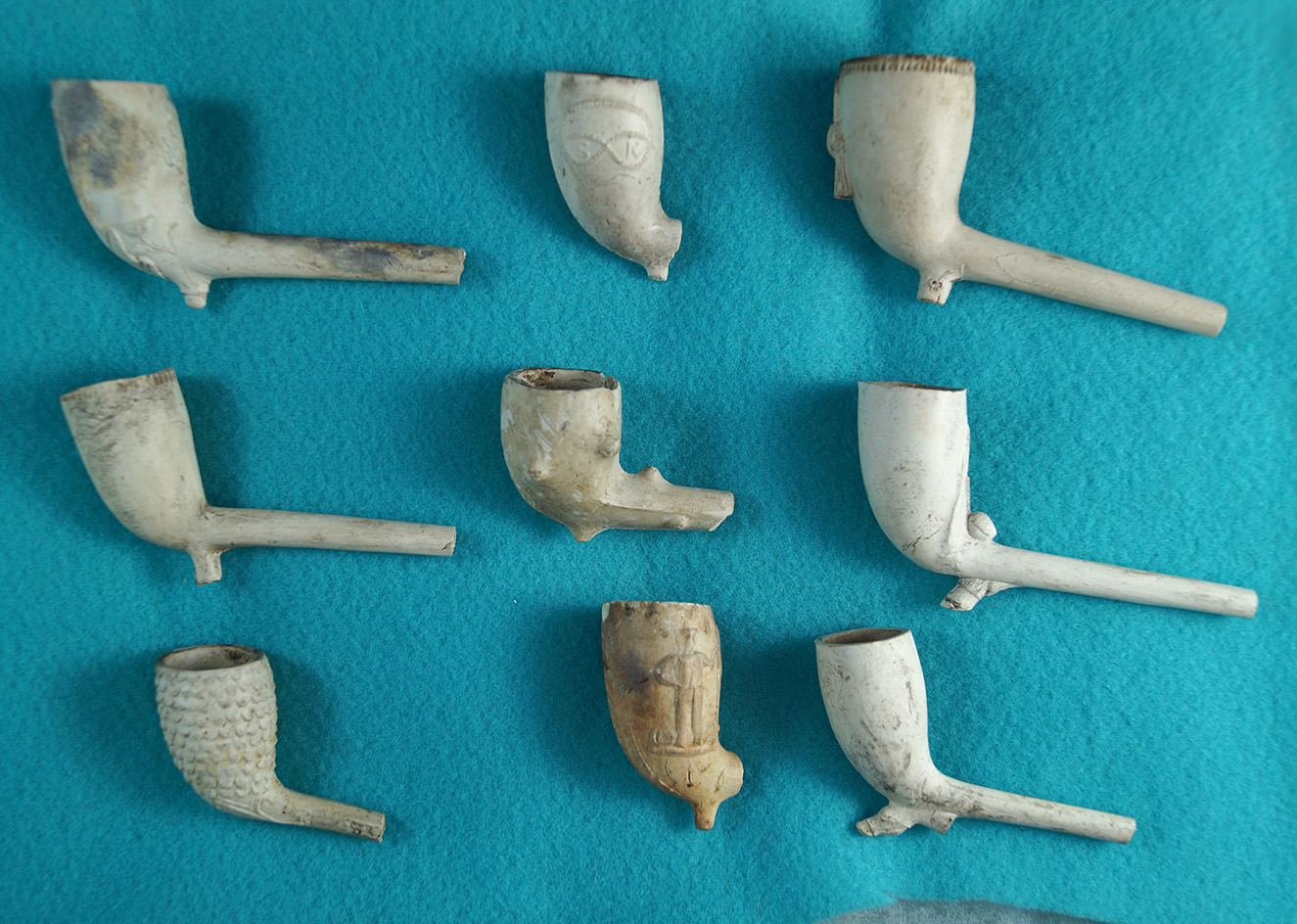 Set of 9 old Tavern Pipes, largest is 3 1/2" long.