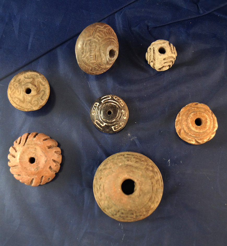 Set of 7 Pre Columbian Pottery Spindle Whorls.  Largest is 1 1/4" diameter.