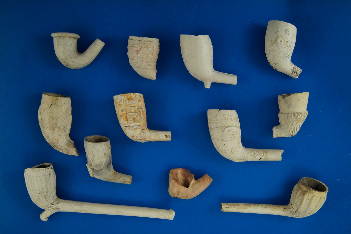 Set of 12 Clay Tavern Pipes, largest is 4 5/8".