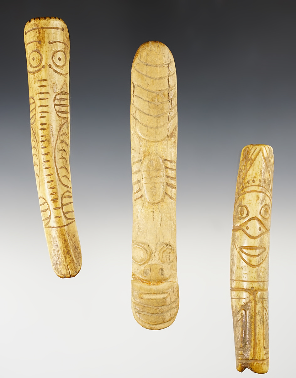 Set of 3 bone artifacts. One is broken and glued. Very ornately carved. The largest is 6 5/16".