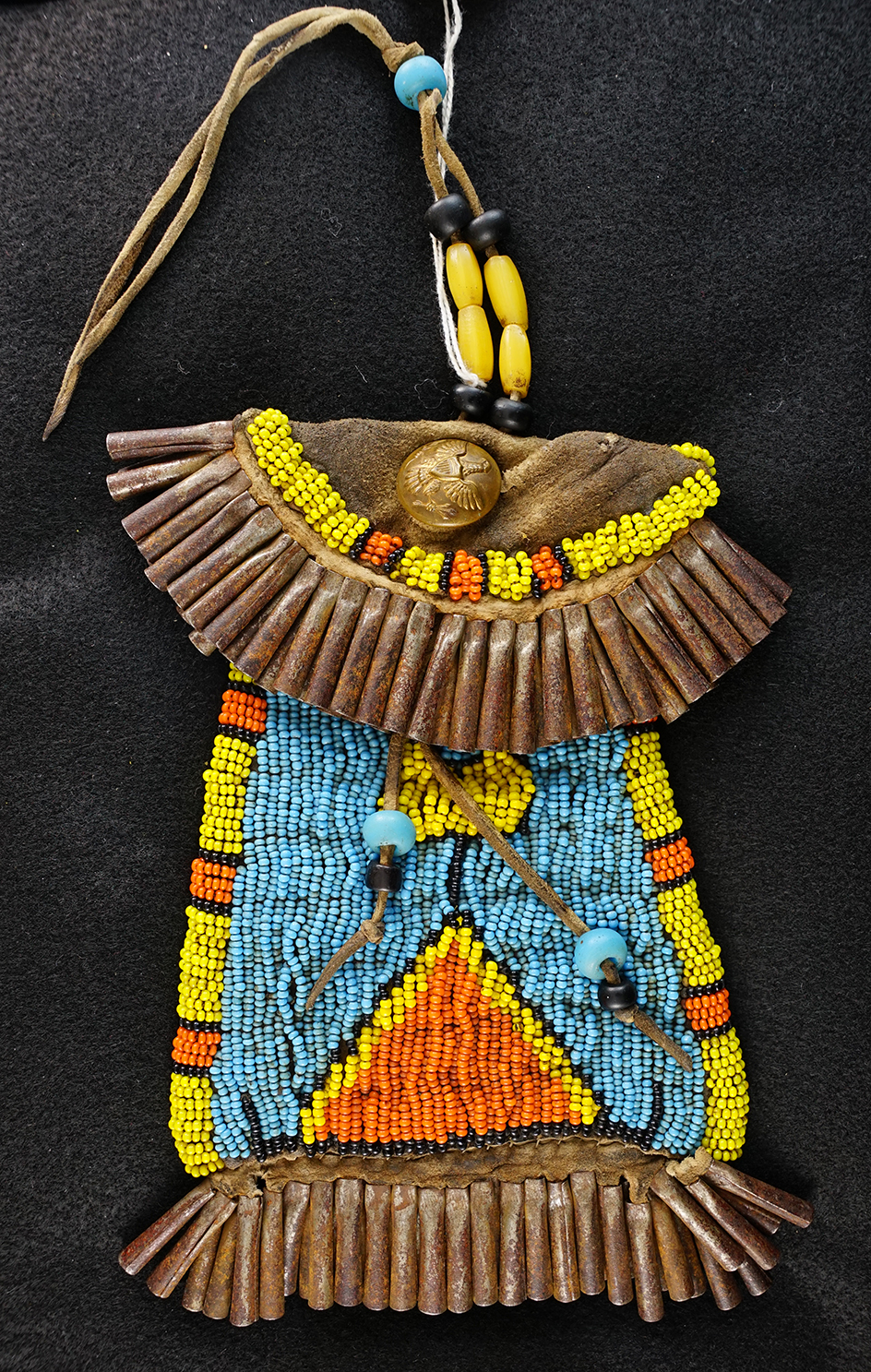 9 1/2" Tall Blackfoot Strike-A-Lite beaded bag.  The interior of the bag has a trade cloth lining.