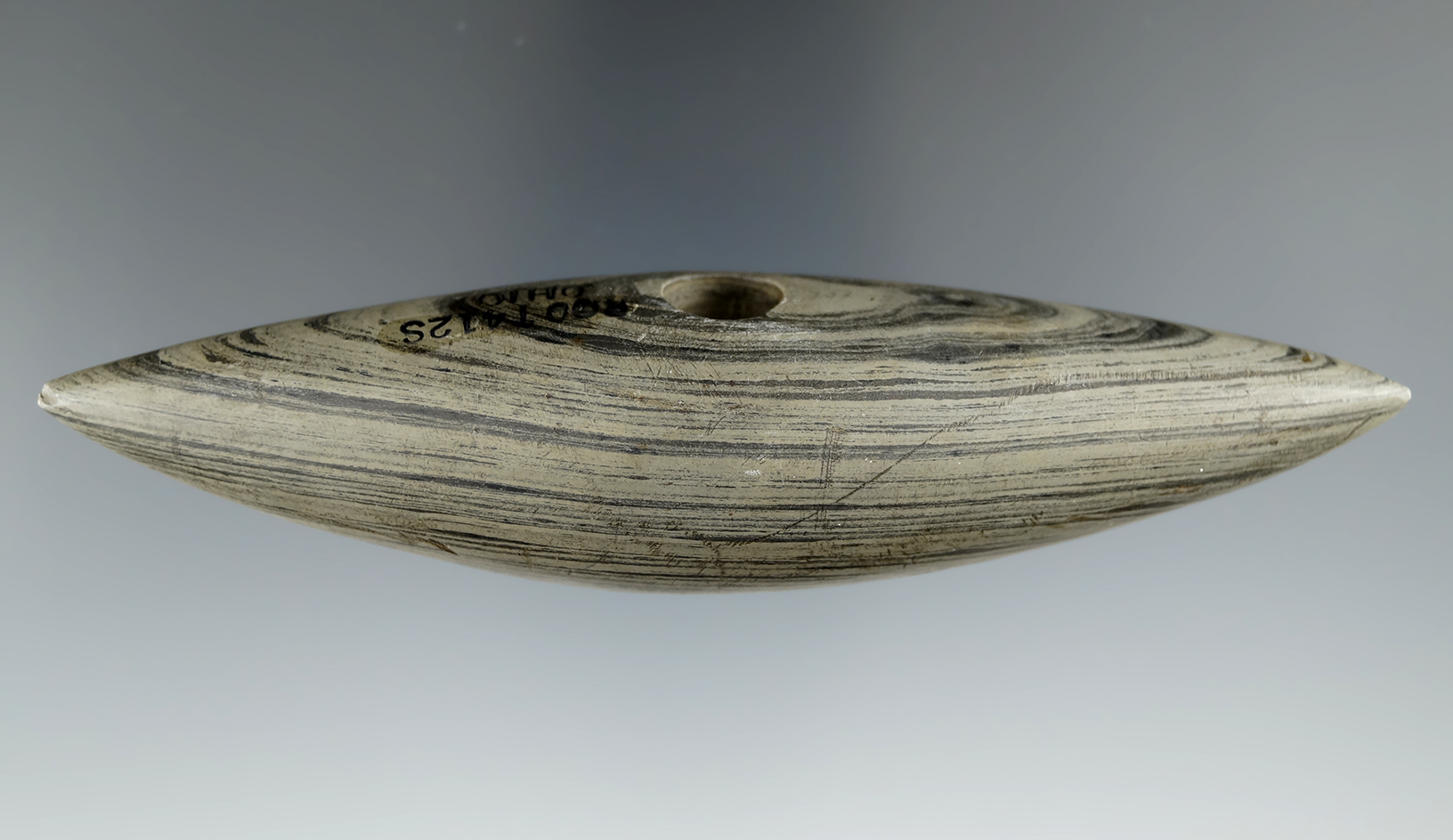 5" Archaic Pick Bannerstone made from green and black Banded Slate, found in Ohio. Pictured.