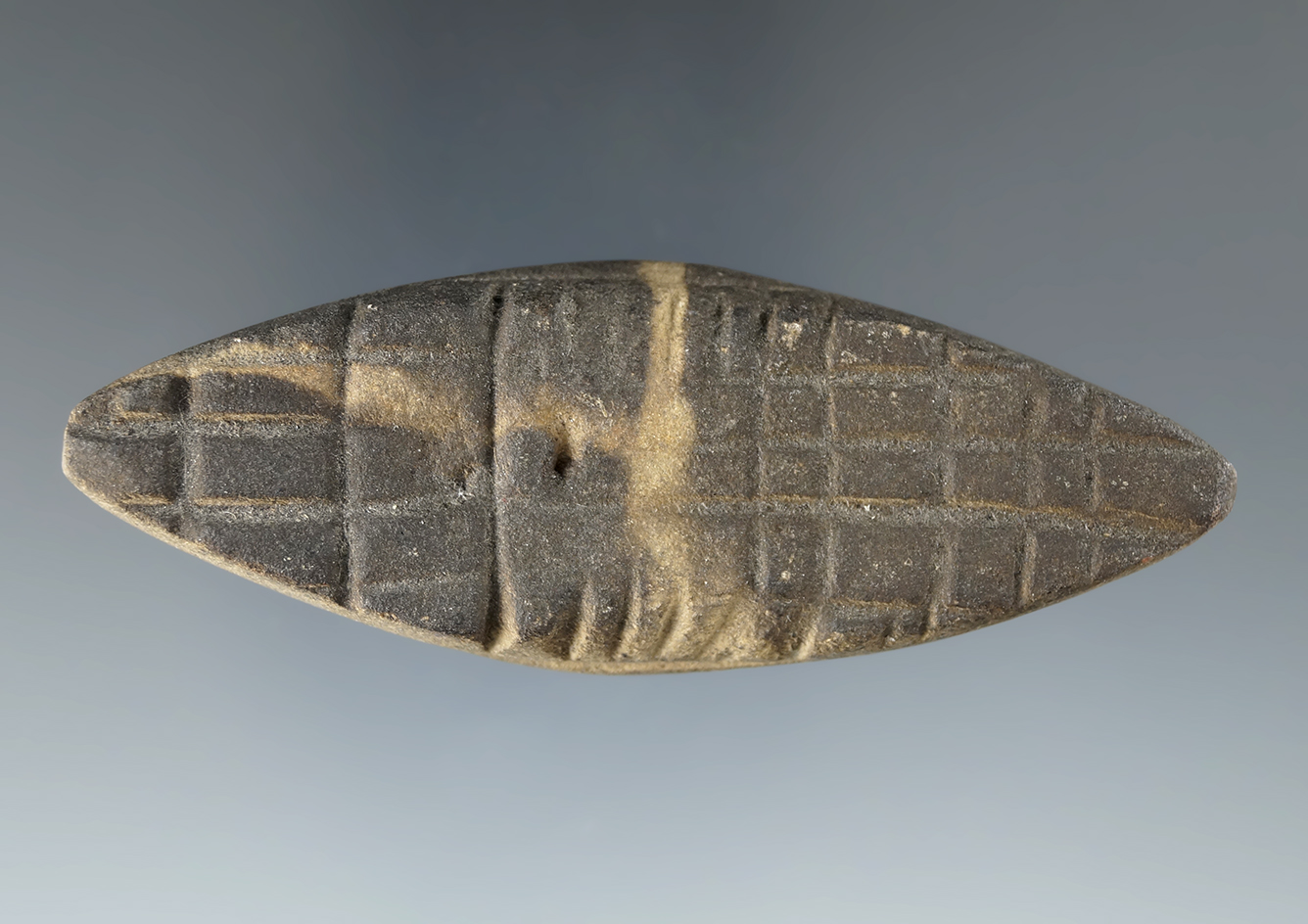 3 1/4" Eliptical tie-on Atl-Atl Weight with grooved ends that is highly engraved, Ohio. Ex. Hasewink