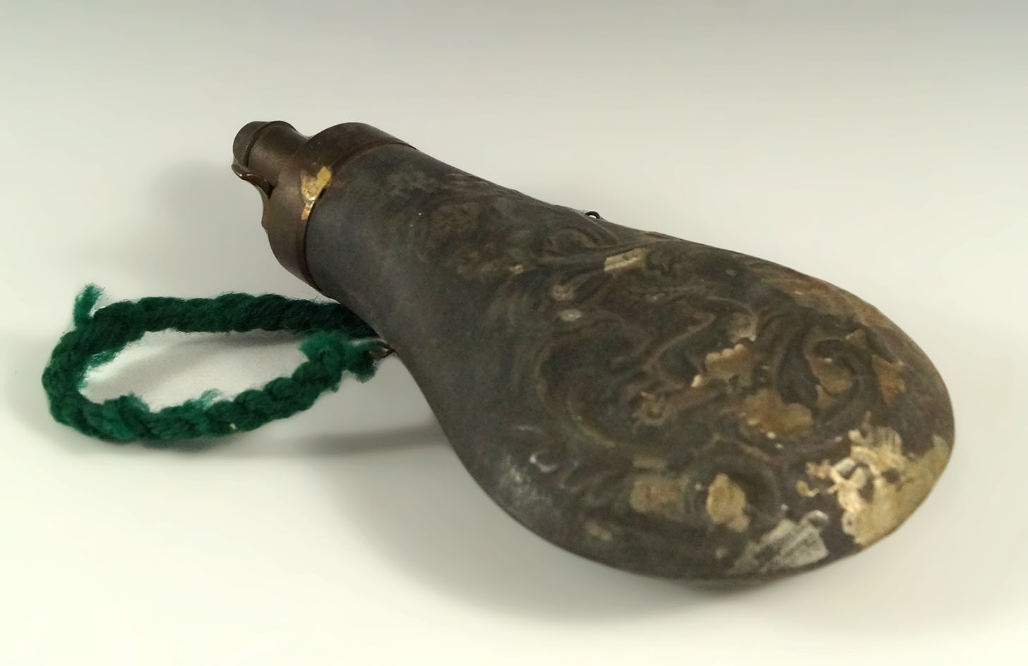 6 3/4" powder flask with a running deer design from the 1860s.