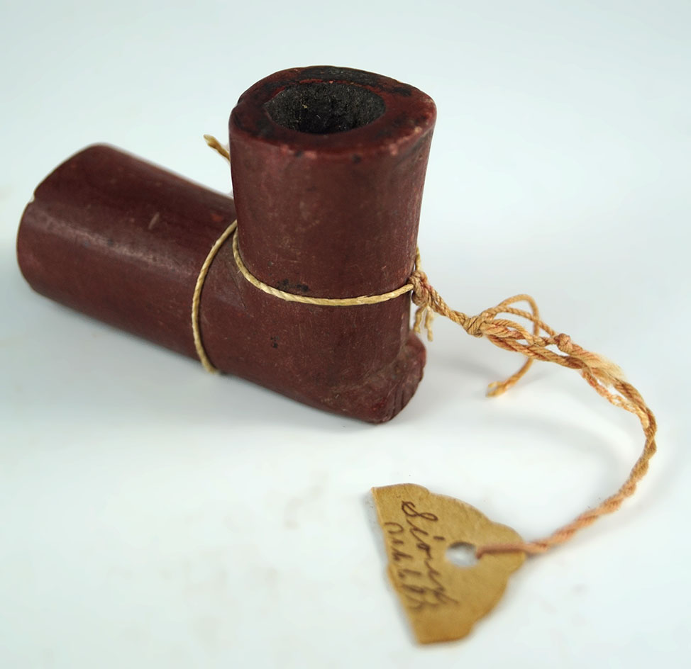 Very nice 1 3/4" minature Catlinite flat bottomed pipe.  Deaccessioned Museum artifact.