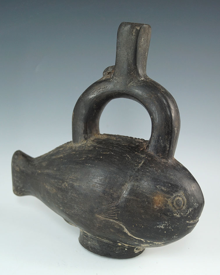 8 1/2" Chimu fish effigy stirrup bottle with nice pedestal base. Coastal Peru. Circa AD 1100.