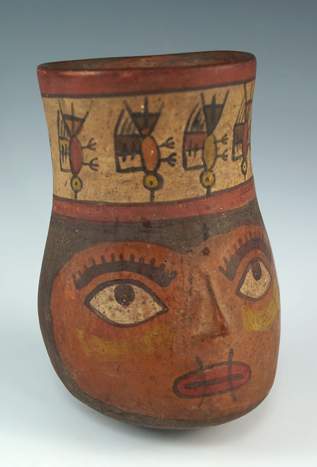 4 1/4" Wari culture face effigy cup found in Peru.