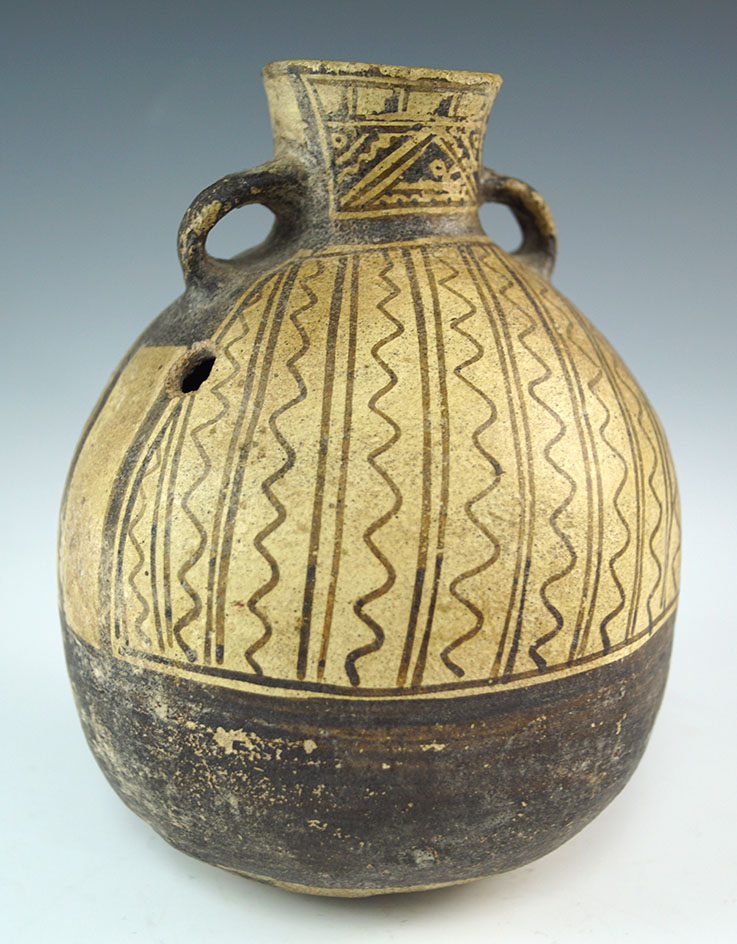 6 1/4" tall strap-handle Chancay culture canteen found in the central Peru area. Intact.