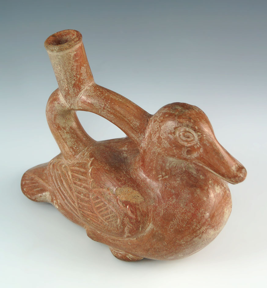 Very nice solid Moche II orange and salmon colored duck effigy vessel that is solid.