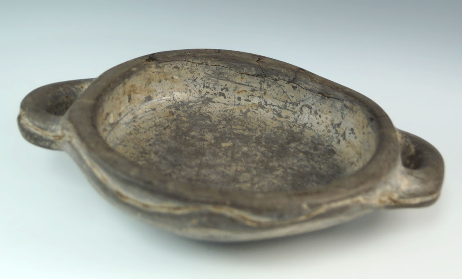 8 5/8" wide by 2 1/4" tall Inca ritual two handled stone bowl carved w/ relief snakes on each side.