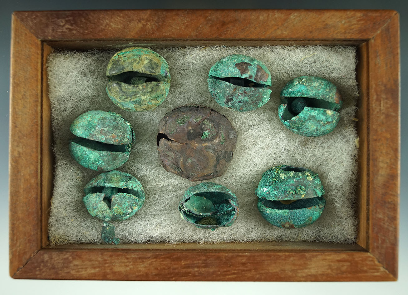 Set of eight nice Moche culture copper bells found in Peru from the Graceline Museum collection.