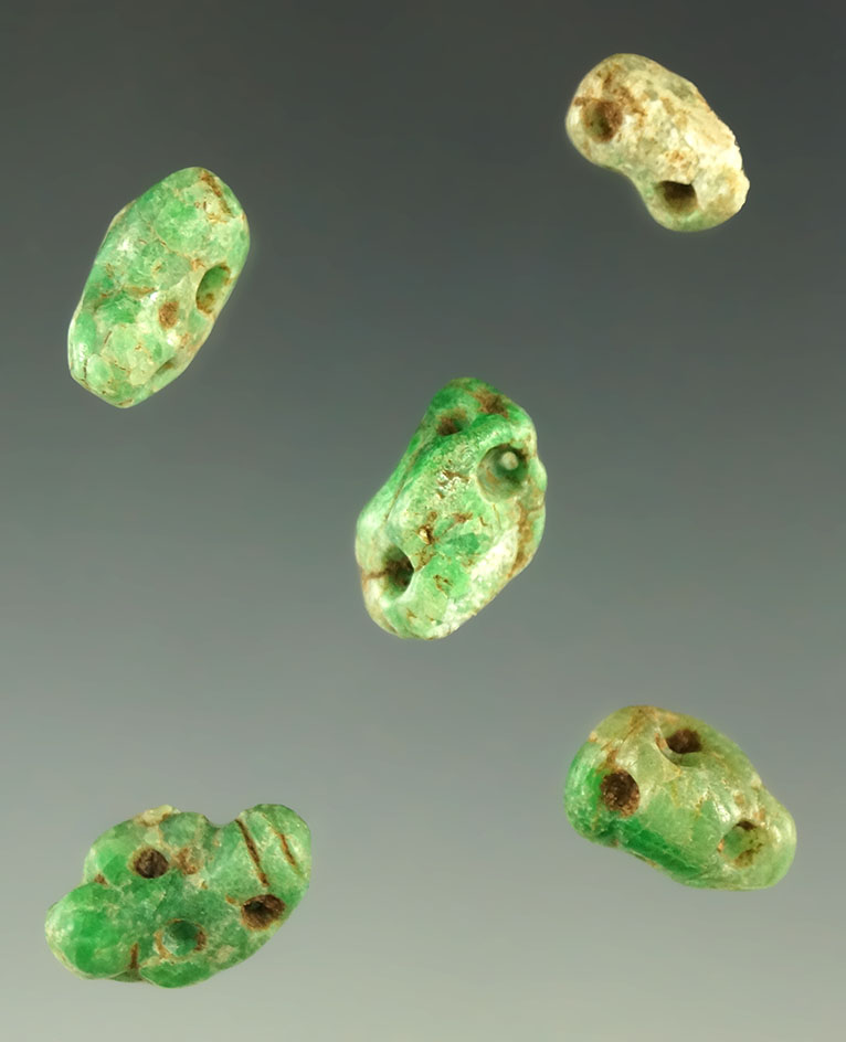 Frame of five Mayan monkey head effigy beads carved from Apple-green Jadeite. Very exquisite.