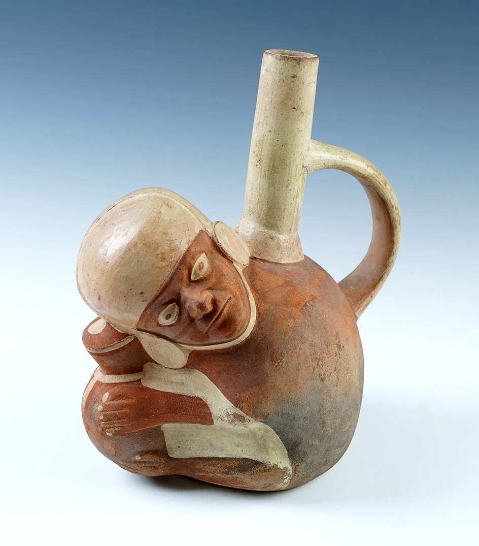 7 3/4" tall x 6 5/8" wide strap handle pottery vessel in solid condition. Andean Mountains Region. 