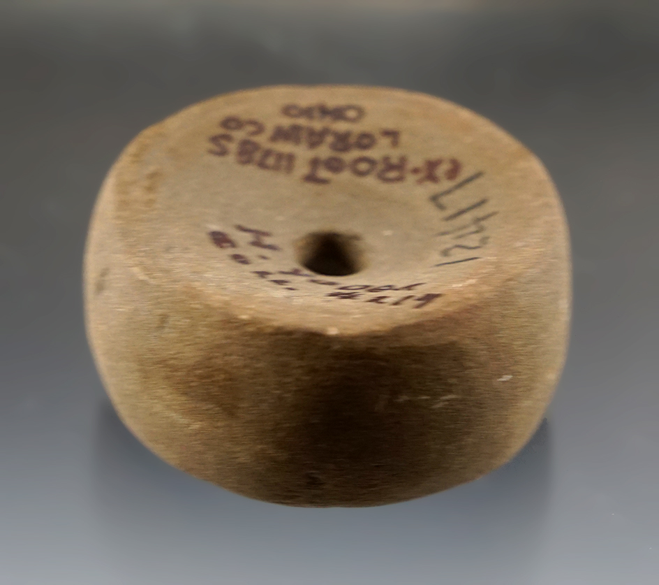 1 3/4" Perforated Sandstone Discoidal that is made from patinated sandstone, Lorain Co., Ohio.