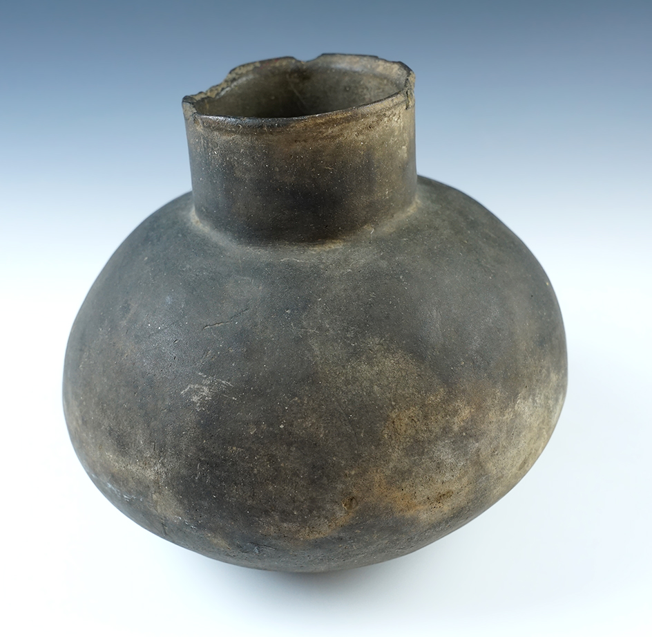 Large solid Mississippian Bottle made from clay found in Arkansas. Some ancient rim chips. 