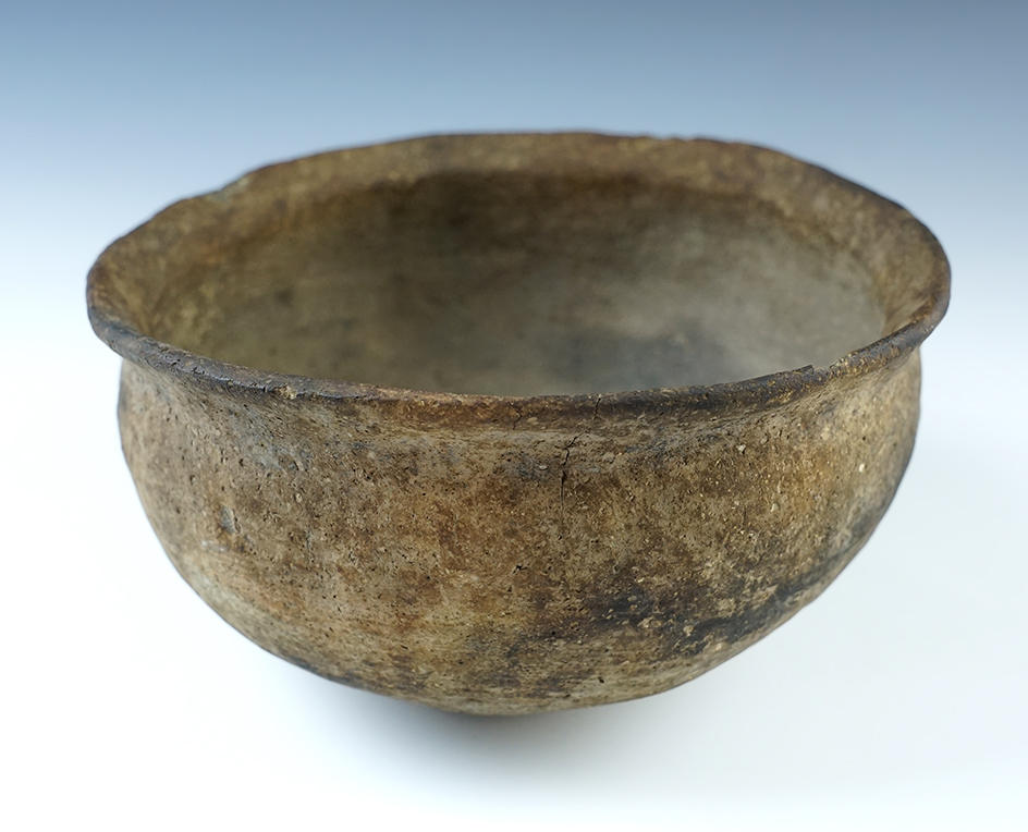 4" wide x 3 1/4" tall ancient pottery vessel recovered in Arkansas. Several large pieces glued back.