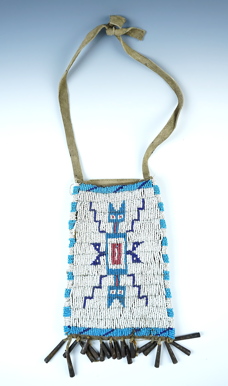 7" by 5" nicely beaded bag made from leather and old U.S. calvary canvas. 