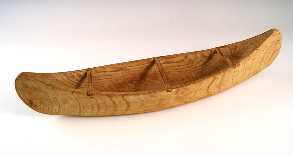 Nicely styled 12" long handmade wood canoe model from a reservation in Canada.