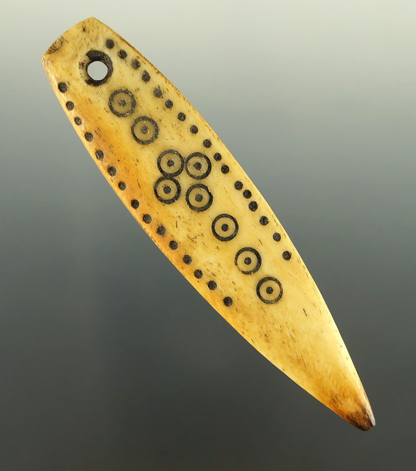 Highly engraved 3 1/2" bone pendant found in Alaska.