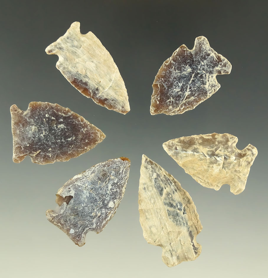 Set of six heavily patinated Knife River Flint arrowheads found in the Dakotas, largest is 1 5/8".