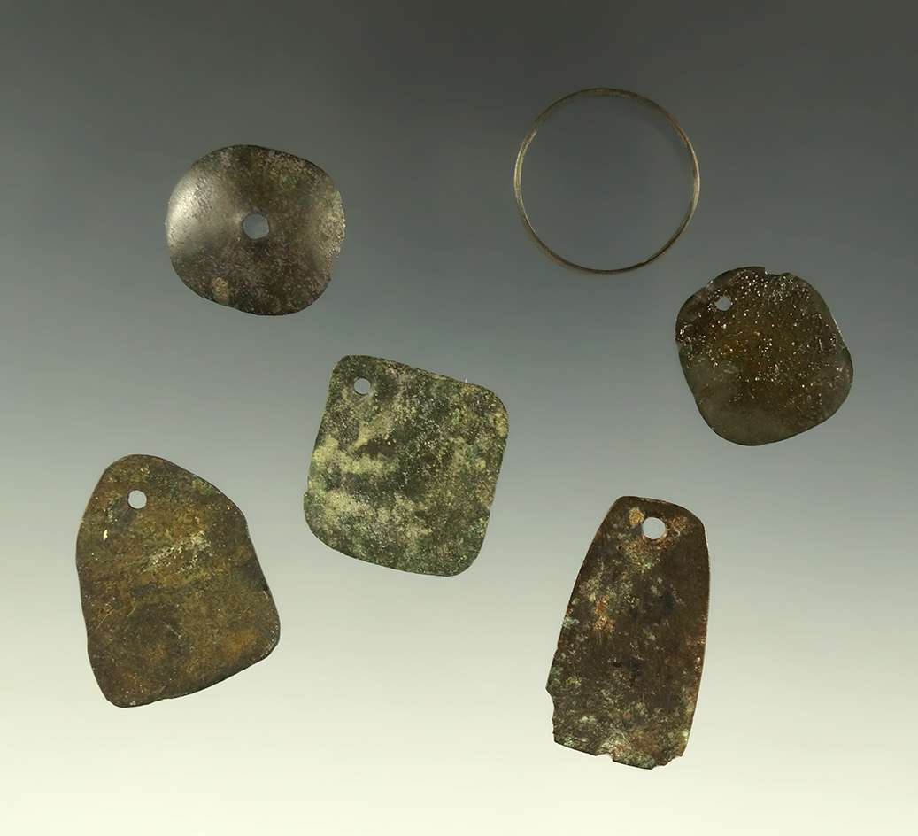 Copper ring and copper pendant found at a site near the Col. River. Largest pendant is 1 3/16".